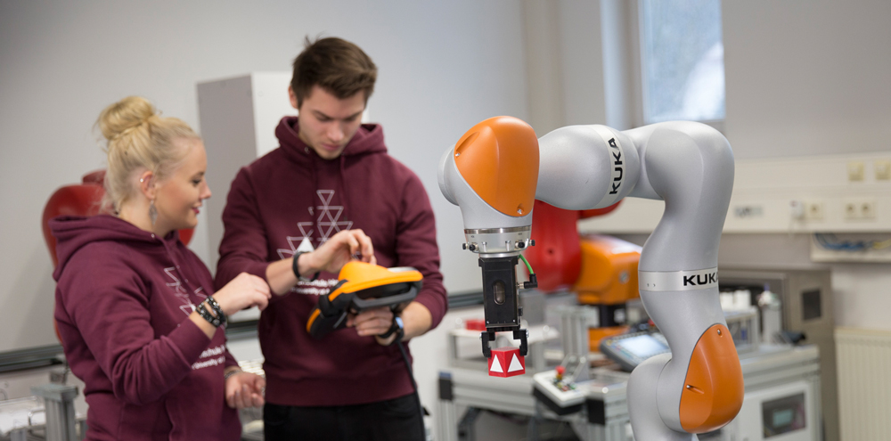 Students in the industrial robot laboratory