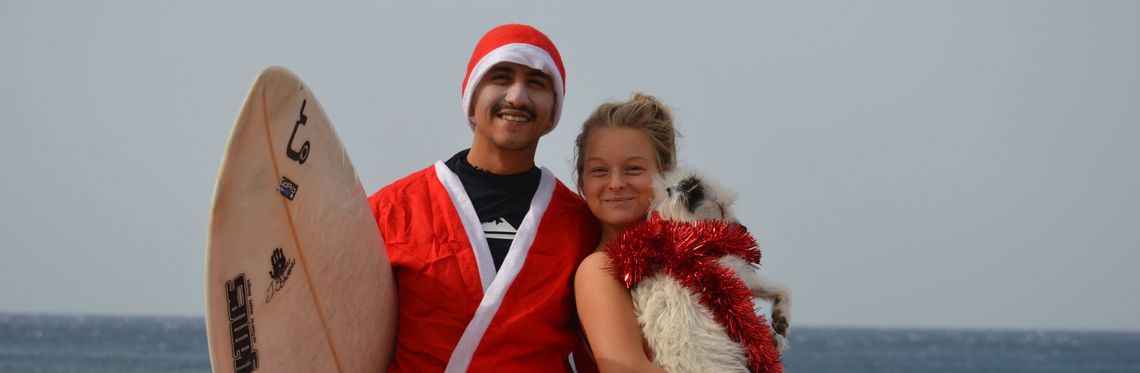 Student with partner and dog at the beach