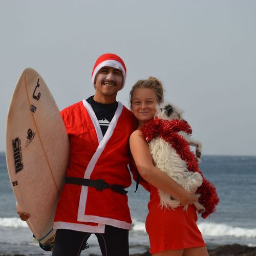 Student with partner and dog at the beach